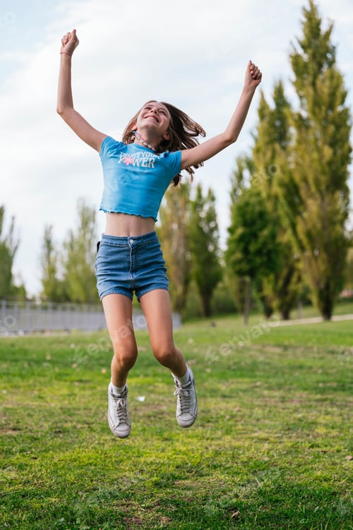 Preview: The very happy girl jumping in nature.