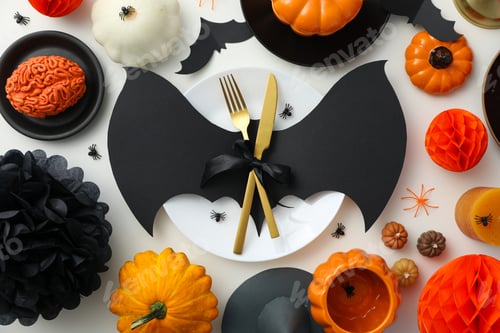 Preview: Table setting for Halloween, spooky decorations with pumpkins and bats
