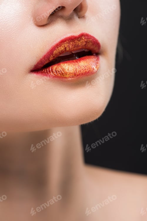 Preview: cropped view of naked girl with orange lips isolated on black