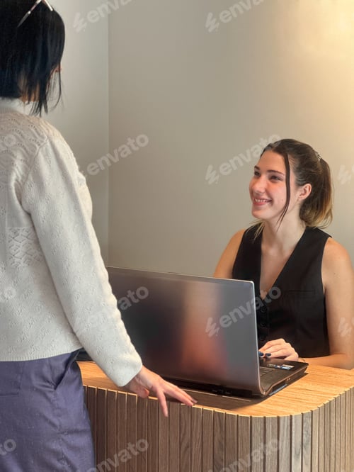 Preview: Receptionist Greeting Customer at Front Desk