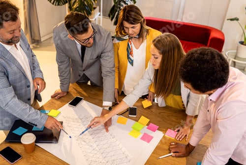 Preview: Diverse group of business people working in office.
