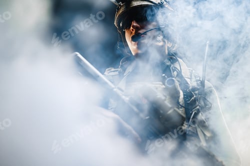 Preview: Portrait of speacial froces soldier standing in smoke in the dark