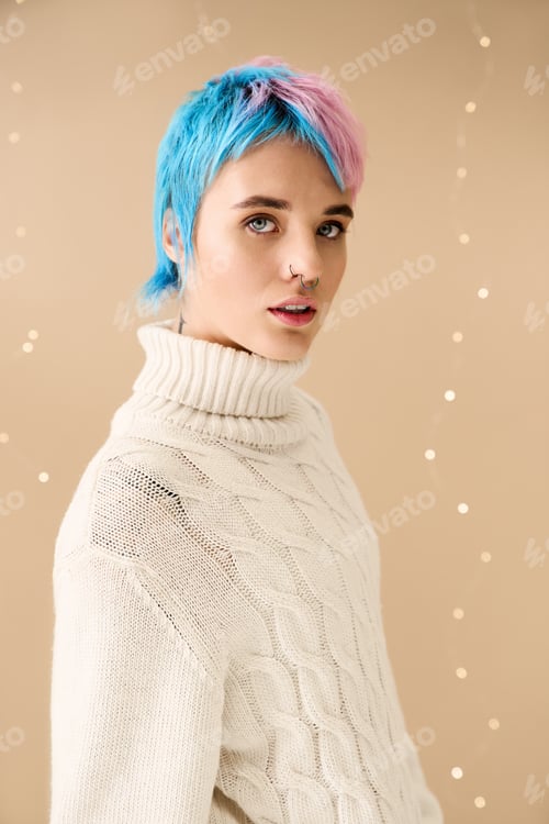 Preview: Festive winter vibes with a young woman in cozy sweater and vibrant hairstyle