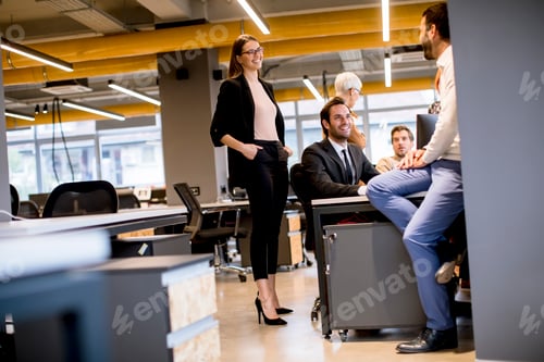 Preview: Senior businesswoman and young business people work in a modern office