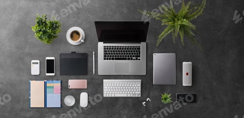 Preview: Flat lay top view office desk working space with laptop and supplies on gray background.