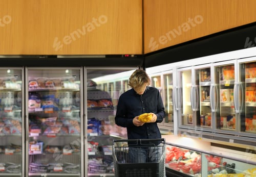 Preview: Man Choosing Frozen Food From A Supermarket Freezer