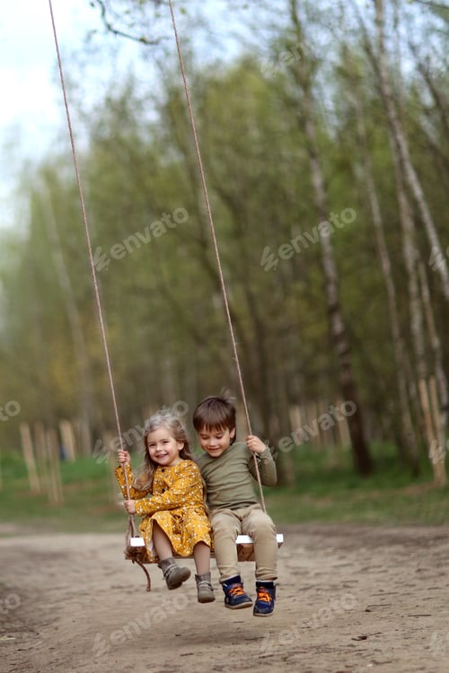 Preview: children a boy and a lion are swinging on a swing