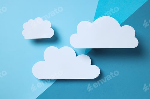 Preview: White, paper clouds on a blue background