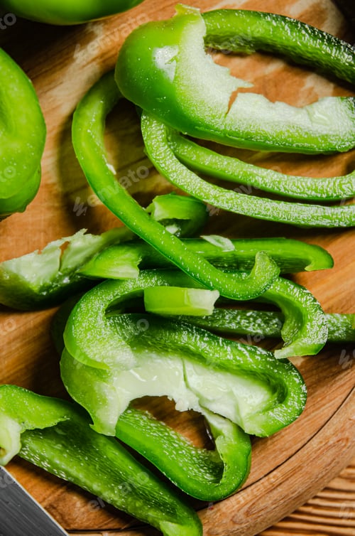 Preview: Chopped sweet pepper. On wooden table.