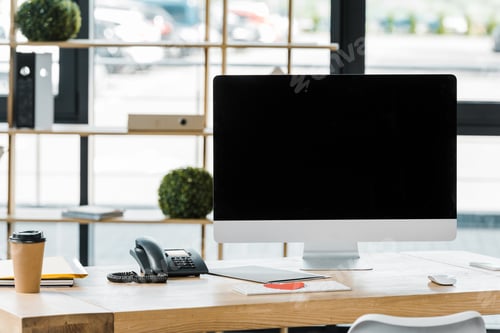 Preview: close up view of workplace with blank computer screen in office