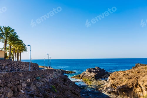 Preview: Evening scene on sea, stones, calm ocean