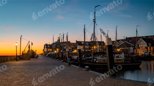 Preview: Urk Flevoland Netherlands sunset at the lighthouse and harbor of Urk Holland