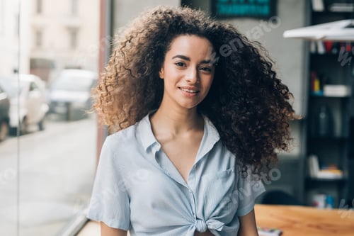 Preview: portrait of young caucasian woman looking at camera
