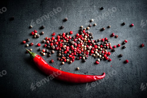 Preview: Peppercorns on a dark background