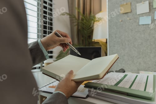 Preview: Typical office work atmosphere for company employees. A businessman is diligently handling important