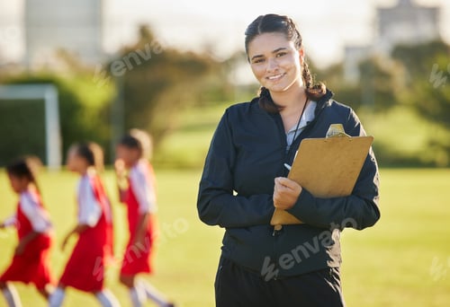 Preview: Soccer field, woman coach with and girl team training on grass in background. Sports, youth develop