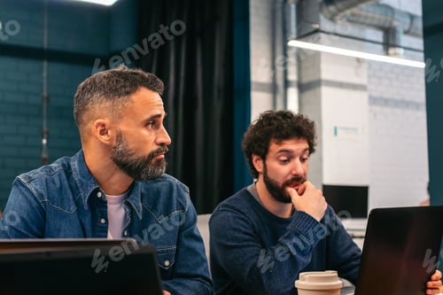 Preview: Coworkers in a company meeting in a coworking office space