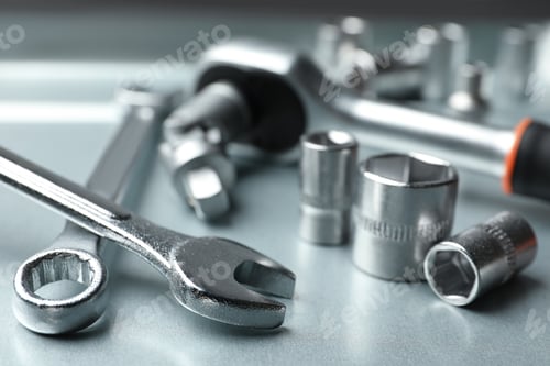 Preview: Auto mechanic's tools on metallic surface, closeup