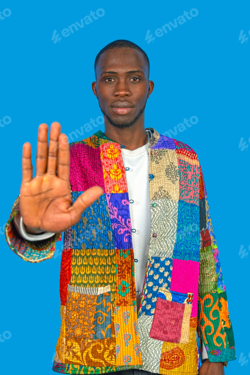 Preview: African man showing stop hand gesture on blue background