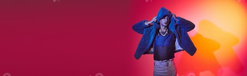 Preview: chic alluring androgynous man in purple faux fur posing with closed eyes on vibrant backdrop, banner