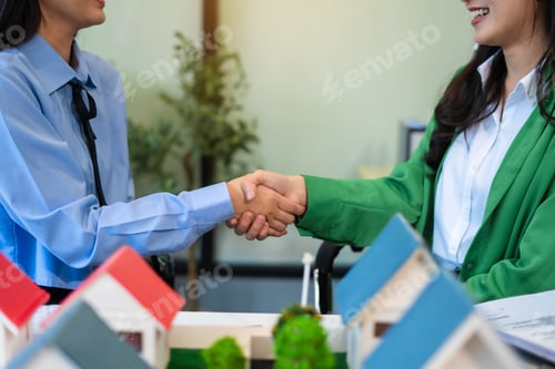 Preview: Close up shake hands, Considering buying a home, investing in real estate.
