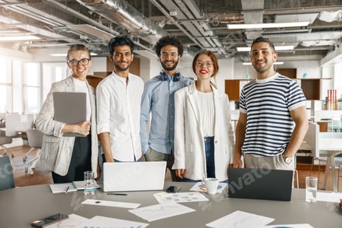Preview: Diverse group of colleagues enjoying working together in an office. Teamwork concept