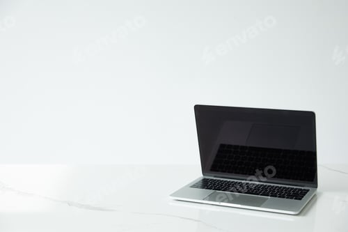 Preview: laptop with blank screen and black keyboard isolated on grey