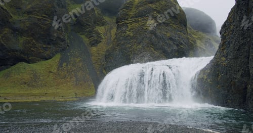 Preview: Beautiful water flow of Stjornarfoss waterfall near Kirkjubaejarklaustur at Iceland South coast