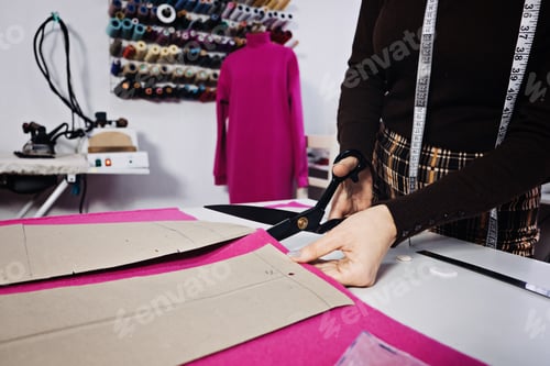 Preview: Hand Cutting Pattern and Fabric Pieces. Fashion Design. Female tailor, seamstress working with