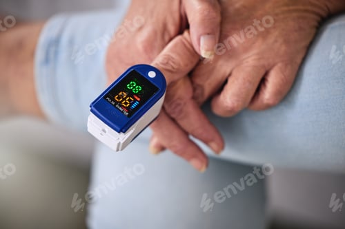 Preview: Pulse oximeter, healthcare and woman taking her heart rate in a retirement home during consultation