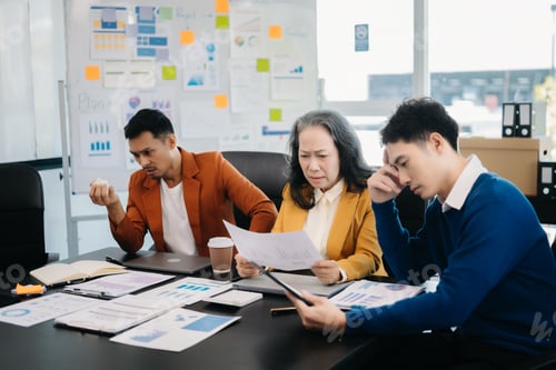 Preview: Team thinking of problem solution Furious two Asian businesspeople arguing strongly after making