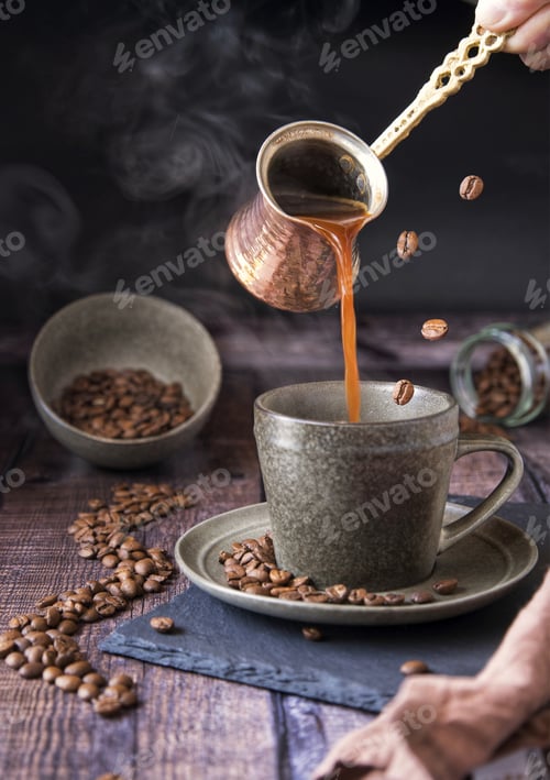 Preview: Person pouring coffee into a cup with spilled beans on the table