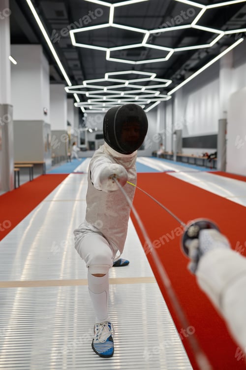 Preview: Swordsman standing in fencing lunge during training fight in fencer club