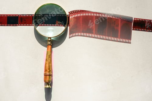 Preview: Analog photography with filmstrip, magnifying glass.