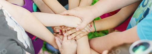 Preview: Children's hands together, street games. Selective focus.