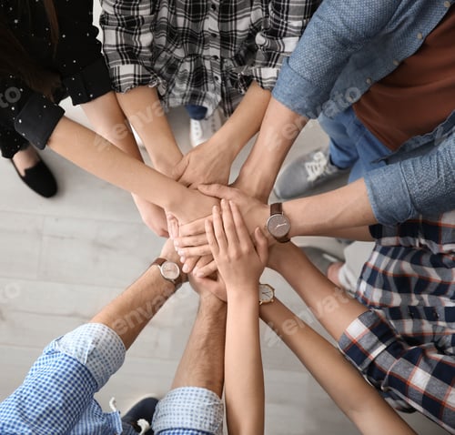 Preview: People putting hands together, top view. Unity concept