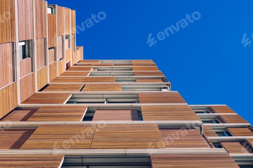 Preview: Building clad in ecological wood over clean blue sky