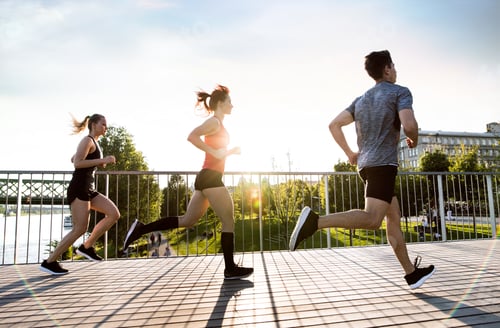 Preview: Young athtletes in the city running at the river.