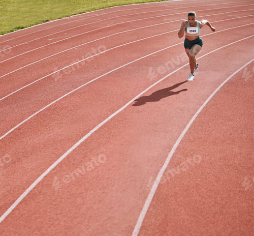 Preview: Woman, athlete and running on stadium in fitness, workout or cardio exercise for practice or traini