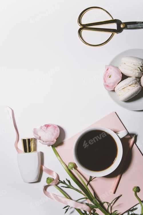 Preview: top view of pink macaroons with roses and coffee on white background with copy space