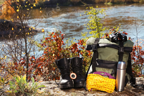 Preview: Set of camping equipment on ground outdoors. Space for text