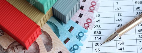 Preview: Company shipping cargo containers in China with yuan money bills and pen