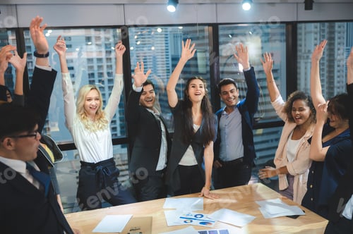 Preview: young business people putting their hands together. Stack of hands. Unity and teamwork concept.
