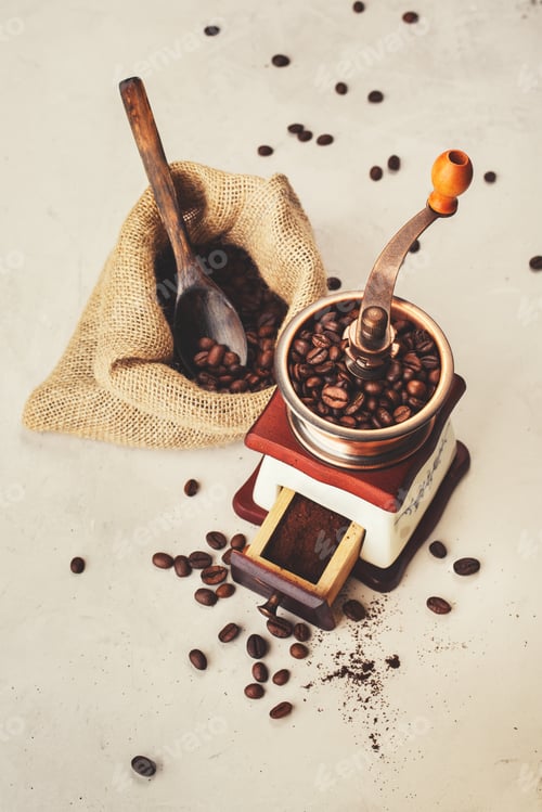Preview: Grinder and a bag of coffee beans.