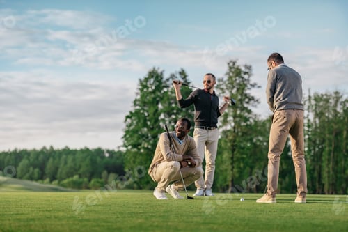 Preview: group of young stylish multicultural friends spending time together while playing golf