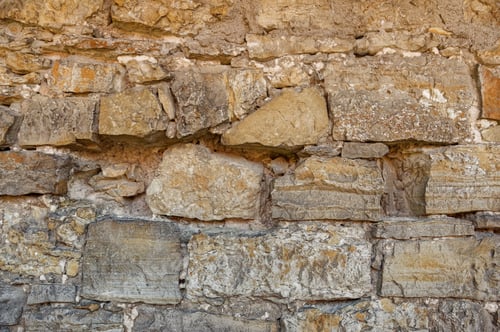 Preview: Wall constructed from large stone blocks with several small slabs placed at regular intervals
