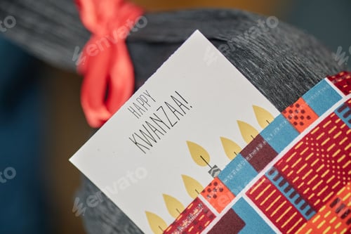 Preview: Greeting Card Displaying Happy Kwanzaa Message with Kinara Illustration