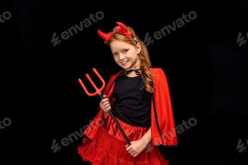 Preview: child in halloween costume of devil with pitchfork, isolated on black