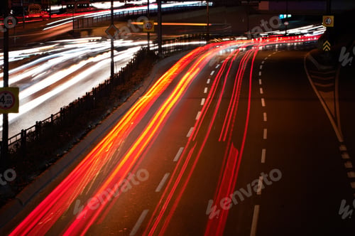 Preview: Blurred Tail Lights And Traffic Lights On Motorway