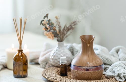Preview: Spa composition with aroma oil diffuser lamp on a blurred background.